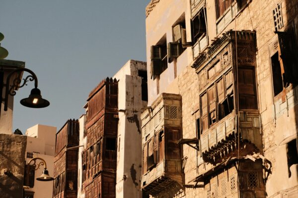 pexels-photo-28506301-28506301 Sunlit traditional architecture in Al-Balad, Jeddah, showcasing historic charm and intricate design.
